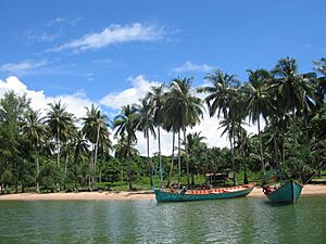 Boats at the sandy beach of the Rabbit Island Koh Tonsay Cambodia