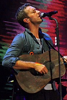 Chris Martin + Guitar, 2011 (1, cropped)