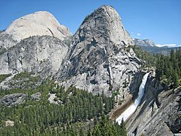 Nevada Falls with Liberty Cap and the back of Half Dome (with Mt Broderick below). View north from Panorama Cliff trail. Little Yosemite Valley is above Nevada Falls on the right. - panoramio.jpg