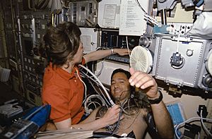 Crewmembers in the spacelab with the Lower Body Negative Pressure Study 2