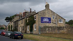 House baring 'vote remain' banner, Main Street, Kirk Deighton (22nd June 2016)