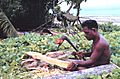 Making paddle with adze, Tobi, Western Caroline Islands, Micronesia