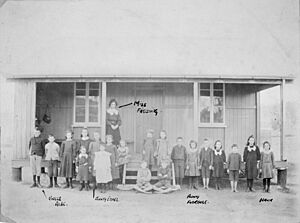Schoolchildren and teacher outside the school at Drummers Creek Queensland 1908 (16282955193)