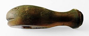 Carved whalebone whistle dated 1821. London. 8 cm long