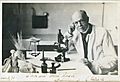Charles Nicolle at microscope