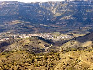 The town with the massive escarpments in the background