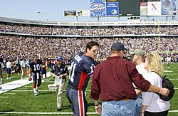 During the pre-game honors, Quarterback Drew Bledsoe of the Buffalo Bills football team, meets with family members of deceased Iraqi war personnel at Niagara Falls, New York, on September 7th, 2003 030907-F-KW623-004