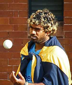 Lasith Malinga tossing a cricket ball at practice.jpg