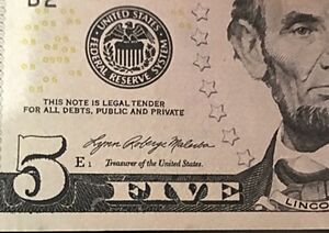 Lynn Malerba's signature on a 5$ bill