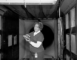 Mary Jackson in a wind tunnel with a model at NASA Langley