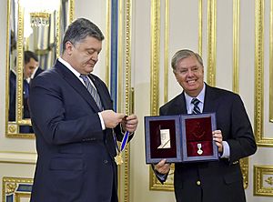 President of Ukraine Petro Poroshenko presented state awards to Senators John McCain and Lindsey Graham, 30 December 2016 (2)