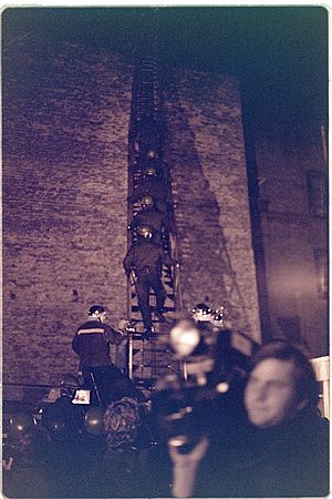 SF Law enforcement officers use LADDER to enter the International Hotel roof, 1977