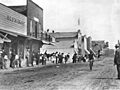 Spectators watching a bicyclist on Beacon Street, San Pedro, ca.1907 (CHS-4783)