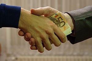 10 - hands shaking with euro bank notes inside handshake - royalty free, without copyright, public domain photo image 01