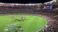 2021 AFL Grand Final, Perth Stadium, Simon Goodwin and Max Gawn hoist up the cup together, 25 September 2021.jpg