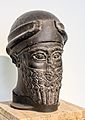 Head of a bearded god wearing a cap with horns dedicated by Puzur-Eshtar of Mari