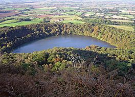 Image looking down of a lake surrounded by trees