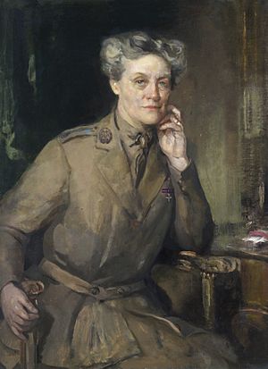 A half length painted portrait of Chalmers Watson, wearing the uniform of Queen Mary's Army Auxiliary Corps.