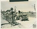 Secretary of War, Mr. Henry L. Stimson and Lt. Gen. Mark W. Clark, commanding general of Fifth Army, and Maj. Gen. Charles W. Ryder, CG 34th Division, passing line of the division soldiers (49617210441)