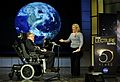 Hawking and his daughter Lucy on stage at a presentation