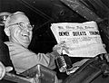 Truman holding Chicago Tribune that says "Dewey Defeats Truman"