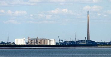 Grain silos, smelter and smoke stack from across the river, Port Pirie, South Australia.jpg