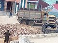 A Kekra truck unloading construction material in Islamkot