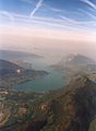 Aerial view of narrow lake between mountains