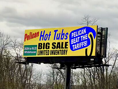 Pelican hot tubs sale billboard reading “Pelican beat the tariffs!”