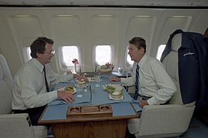 President Ronald Reagan eating lunch with Raymond Donovan aboard Air Force One