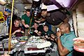 STS 129 Expedition 21 crew members having dinner in Node 1