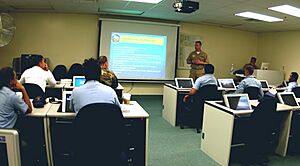 US Navy 070327-N-1810F-012 Chief Yeoman Toby Messenger, special program recruiter for Naval Special Warfare Development Group, speaks to Sailors during the Career Management Symposium at Naval Station Mayport