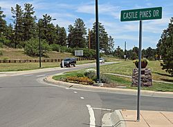 Looking uphill from the intersection of Happy Canyon Road and Castle Pines Drive.