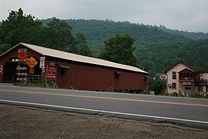 Forksville Covered Bridge, built 1850, over Loyalsock Creek with the Forksville General Store behind