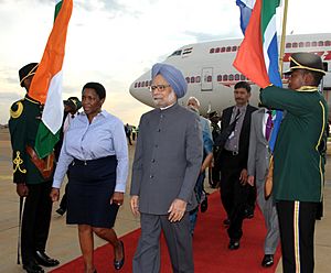 Manmohan Singh being received by the Minister for Social Justice, South Africa, Ms. Bathabile Dlamini, on his arrival at Waterkloof Air Force Base, Pretoria for the 5th IBSA Summit, in South Africa on October 17, 2011 (1)