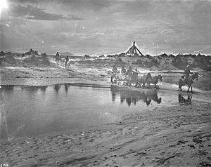 Navaho Indians crossing the Little Colorado River, ca.1900 (CHS-5136)