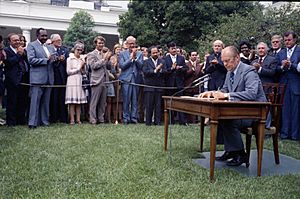 President Gerald R. Ford Signing H.R. 6219, Extending the Voting Rights Act of 1965, at a Ceremony in the Rose Garden - NARA - 23898507