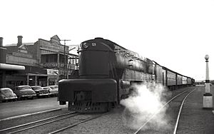 SAR locomotive 521 in Ellen Street, Port Pirie, with evening train from Adelaide, 22 Aug 1963 (Richard T Horne)