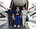 US Navy 101009-N-6003P-082 Retired astronauts Capt. Jim Lovell, Capt. Gene Cernan, and Neil Armstrong stand on painted footprints to commemorate th