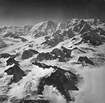 Capps and Triumvirate Glaciers, valley glaciers, bergschrund, and aretes seperating glaciers, August 26, 1969 (GLACIERS 6449).jpg