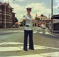Constable Diana Hotchkis models the new female summer uniform consisting of a light blue safari jacket with dark blue pockets and bell bottom slacks, 1979. Note her matching blue eyeshadow