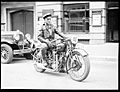Male Motorcycle rider posing with a Rudge racing bike, No. 45