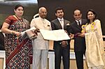 Ram Nath Kovind presenting the Dada Saheb Phalke Award to Veteran Actor Vinod Khanna (posthumous), the award received by his wife Ms. Kavita Khanna and son Akshay Khanna, at the 65th National Film Awards Function.JPG