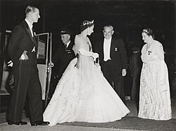 SLNSW - Queen Elizabeth and Prince Philip, Duke of Edinburgh, greeted by the Premier of New South Wales Cahill and Mrs Cahill on arrival at David Jones Elizabeth Street Store, Sydney, for the State Dinner (4 February 1954)