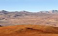 Atacama Desert in foreground with Andes mountains in distance