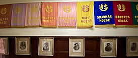Display in University High School, Victoria, with the names of the former school houses and portraits of formed students who served in the First World War