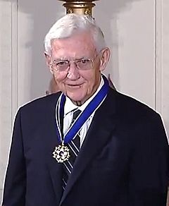Older man wearing a medal