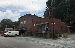 Cluster of old buildings in Moncure; post office on the right