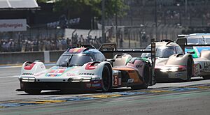 Porsche 963 - Felipe Nasr, Mathieu Jaminet & Nick Tandy leads Porsche 963 - da Costa, Stevens & Ye out of Dunlop Chicane at the 2023 Le Mans (53366861618)