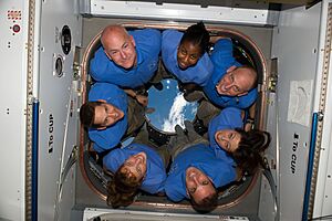 STS-131 crew members in ISS Cupola